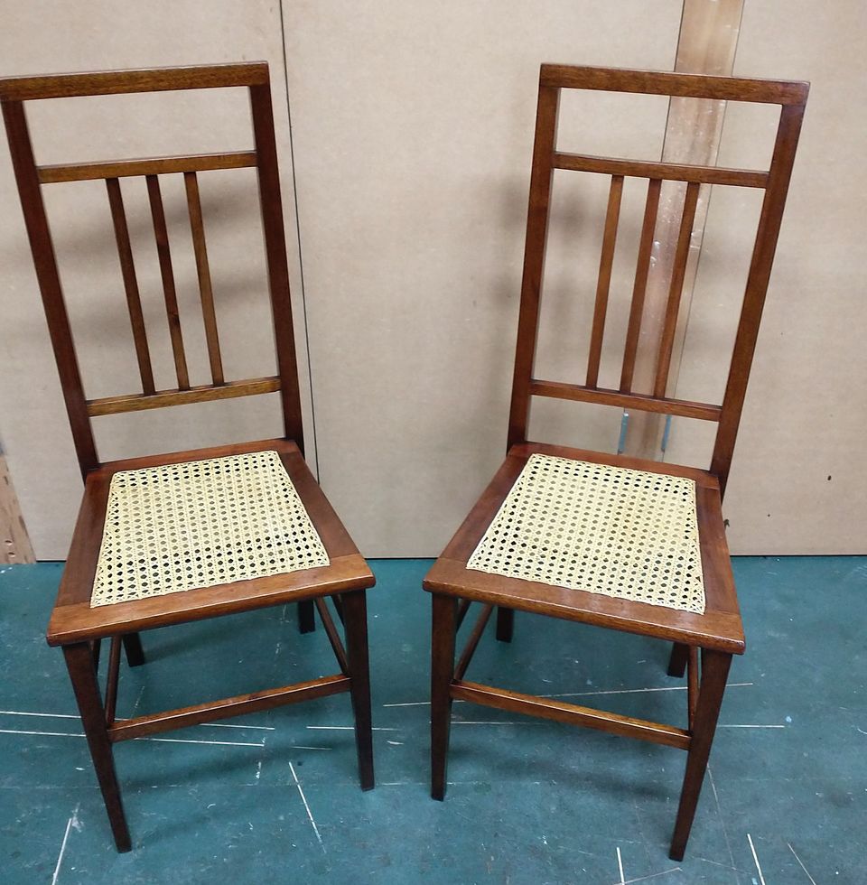 Pair of slender bedroom chairs with newly hand-caned seats