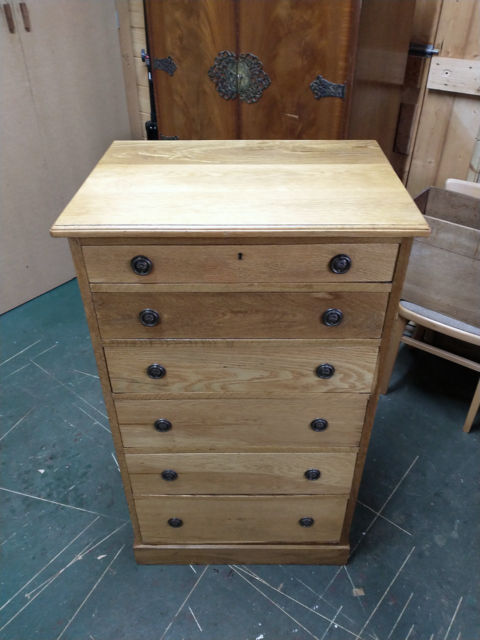 The same tall six-drawer chest after refinishing